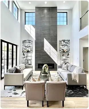 Luxury AAC concrete home interior with double-height living room, floor-to-ceiling fireplace, and modern furnishings